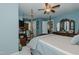 Spacious bedroom with a four-poster bed, dresser, and ample storage at 114 Fieldstone Dr, Burlington, NC 27215