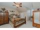 Inviting bedroom showcasing an iron bed frame, rustic accents, and soft lighting at 114 Fieldstone Dr, Burlington, NC 27215