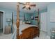 Comfortable bedroom featuring a wooden canopy bed and serene blue walls at 114 Fieldstone Dr, Burlington, NC 27215