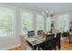 This bright dining room features large windows providing ample natural light and a beautiful view at 114 Fieldstone Dr, Burlington, NC 27215