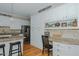 Kitchen with granite counters, white cabinetry, stainless appliances, a breakfast bar and a built-in desk space at 114 Fieldstone Dr, Burlington, NC 27215