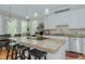 Charming eat-in kitchen with granite counters, stainless appliances, and an island with bar seating at 114 Fieldstone Dr, Burlington, NC 27215