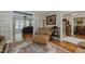 Bright living space with hardwood floors, neutral tones, and access to multiple rooms at 114 Fieldstone Dr, Burlington, NC 27215