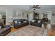 Open living area with hardwood floors, comfortable seating, and ample natural light at 114 Fieldstone Dr, Burlington, NC 27215