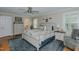 The main bedroom features wood floors, a ceiling fan, a walk-in closet, and an en-suite bathroom at 114 Fieldstone Dr, Burlington, NC 27215