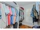 Organized walk-in closet with custom shelving, ample hanging space, and natural light at 114 Fieldstone Dr, Burlington, NC 27215