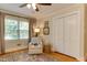 Bright bedroom features hardwood floors, large windows, and neutral walls at 1206 Ivy Ln, Raleigh, NC 27609