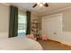 Bright bedroom features hardwood floors, large windows, and a closet at 1206 Ivy Ln, Raleigh, NC 27609
