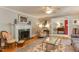 Inviting living room featuring a fireplace and elegant furnishings at 1206 Ivy Ln, Raleigh, NC 27609