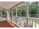 Enclosed sunroom with screen windows, a ceiling fan, and views of the backyard at 1206 Ivy Ln, Raleigh, NC 27609