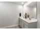 Bathroom featuring double vanity, a large mirror, and neutral color scheme at 1230 Adrian Ct, Mebane, NC 27302