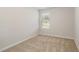Cozy bedroom with neutral carpet, a window letting in natural light, and freshly painted walls at 1230 Adrian Ct, Mebane, NC 27302