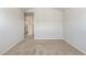 Bedroom with neutral carpet and access to the laundry room and walk-in closet at 1230 Adrian Ct, Mebane, NC 27302