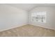 Bedroom with neutral carpet, white walls, and a window for natural light at 1230 Adrian Ct, Mebane, NC 27302