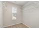 Walk-in closet with white wire shelves and a window at 1230 Adrian Ct, Mebane, NC 27302