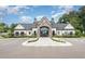 Elegant clubhouse with stone accents, large windows, manicured landscaping, and convenient parking at 1230 Adrian Ct, Mebane, NC 27302