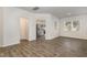 Spacious living room featuring hardwood floors, a view to kitchen with stainless steel appliances, and plenty of sunlight at 1230 Adrian Ct, Mebane, NC 27302