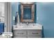 Downstairs half bath with vanity, framed mirror and contemporary lighting at 12417 Kendall Ridge Ct, Durham, NC 27703