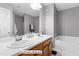 The primary bathroom has a double sink vanity and tub at 12417 Kendall Ridge Ct, Durham, NC 27703