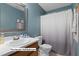 Upstairs full bathroom with vanity, toilet and bathtub with shower at 12417 Kendall Ridge Ct, Durham, NC 27703