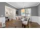 Well-appointed dining room showcasing modern decor, a large window, and comfortable seating arrangements at 12417 Kendall Ridge Ct, Durham, NC 27703