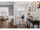 Inviting foyer featuring hardwood floors, console table, and views into the living and dining areas at 12417 Kendall Ridge Ct, Durham, NC 27703