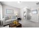 Cozy living space featuring comfortable seating and an open doorway to another room at 12417 Kendall Ridge Ct, Durham, NC 27703
