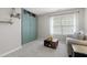 Bright loft area with a space-saving Murphy bed and built-in shelving offering versatile living at 12417 Kendall Ridge Ct, Durham, NC 27703