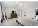 Large main bedroom with carpeted floors leading to the ensuite bathroom at 12417 Kendall Ridge Ct, Durham, NC 27703