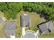 Aerial view of house with a manicured lawn and a screened-in porch with patio furniture at 1304 Essex Skipper Way, Fuquay Varina, NC 27526