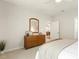 Bedroom with a dresser and view into the hall and kitchen at 1304 Essex Skipper Way, Fuquay Varina, NC 27526