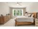 Serene bedroom with ample natural light, a cozy bed, and stylish furnishings at 1304 Essex Skipper Way, Fuquay Varina, NC 27526