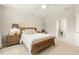 Cozy bedroom with a comfortable bed, soft lighting, and a view of the backyard at 1304 Essex Skipper Way, Fuquay Varina, NC 27526