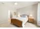 Bedroom with ceiling fan, ensuite bathroom, and night stands at 1304 Essex Skipper Way, Fuquay Varina, NC 27526
