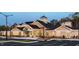 Striking image of the community clubhouse with well-lit parking area, lush landscaping, and elegant architectural details at 1304 Essex Skipper Way, Fuquay Varina, NC 27526
