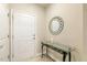 Welcoming entryway with a decorative mirror and a glass-topped console table at 1304 Essex Skipper Way, Fuquay Varina, NC 27526