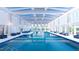Grand indoor pool with ample seating, natural light, and resort-style atmosphere offering a relaxing and luxurious experience at 1304 Essex Skipper Way, Fuquay Varina, NC 27526