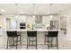 Bright kitchen featuring a large center island with pendant lighting and seating at 1304 Essex Skipper Way, Fuquay Varina, NC 27526