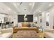 Cozy living room featuring comfortable seating, natural light, and modern decor at 1304 Essex Skipper Way, Fuquay Varina, NC 27526
