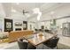 Open-concept living room, kitchen, and dining area with modern finishes and ample natural light at 1304 Essex Skipper Way, Fuquay Varina, NC 27526