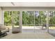 Inviting screened-in porch with ample seating and views of the lush backyard at 1304 Essex Skipper Way, Fuquay Varina, NC 27526