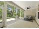 Cozy screened-in porch with a comfortable seating area and views of the peaceful outdoors at 1304 Essex Skipper Way, Fuquay Varina, NC 27526