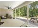 Relaxing screened-in porch with seating areas for outdoor dining and lounging at 1304 Essex Skipper Way, Fuquay Varina, NC 27526