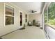 Exterior view of a screened porch with patio furniture, great for entertaining at 1304 Essex Skipper Way, Fuquay Varina, NC 27526