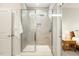 Updated shower features glass doors, niche, and overhead lighting at 1304 Essex Skipper Way, Fuquay Varina, NC 27526