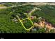 Aerial view showing lot location within a community surrounded by lush green trees at 1329 Wynncrest Ct, Raleigh, NC 27603
