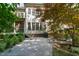 Back patio with lounge seating, lush landscaping, and back of home at 1329 Wynncrest Ct, Raleigh, NC 27603
