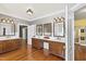 Bathroom featuring double vanities with wood cabinets, large mirrors, and plenty of counter space at 1329 Wynncrest Ct, Raleigh, NC 27603