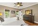 Bedroom boasts natural light, a balcony view, and dark wood furniture adding warmth and sophistication at 1329 Wynncrest Ct, Raleigh, NC 27603