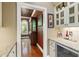Butler's Pantry near the dining room with a granite countertop and wine refrigerator at 1329 Wynncrest Ct, Raleigh, NC 27603